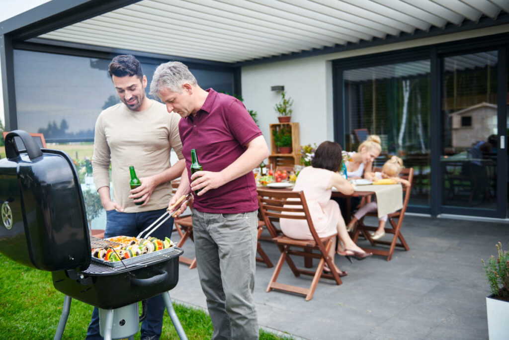two families enjoying a patio barbeque